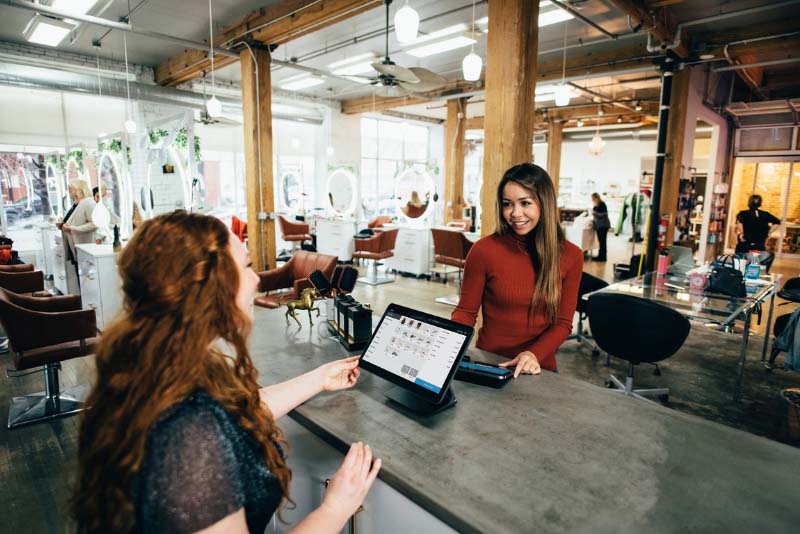 stockphoto two women talking at table